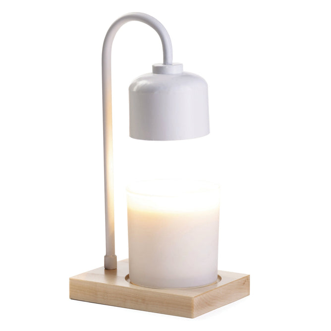 The Arched Candle Warmer Lamp by Candle Warmers Etc. has an elegant design with a curved neck lamp over a lit white candle on a light wood base, enhancing any home décor with its modern style and warm ambiance.