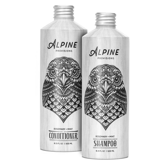 Two silver bottles of Alpine Provisions Shampoo and Conditioner Set - Rosemary Mint, each 16.9 fl oz (500 ml), display an intricate owl illustration, highlighting essential details for a refreshing hair cleansing experience as part of our natural line.
