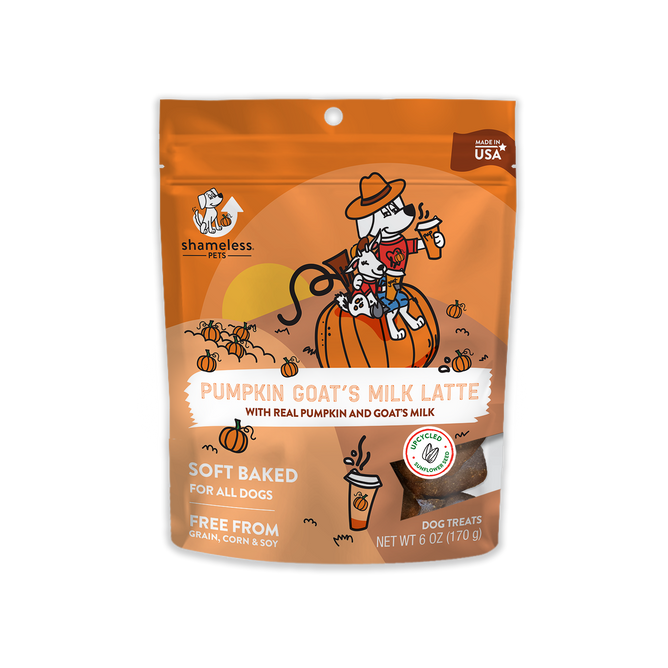A 6 oz orange bag of Shameless Pets Pumpkin Goats Milk Latte treats features playful cartoons of a dog and goat on a pumpkin. The soft-baked snacks are made in the USA and free from grain, corn, and soy.