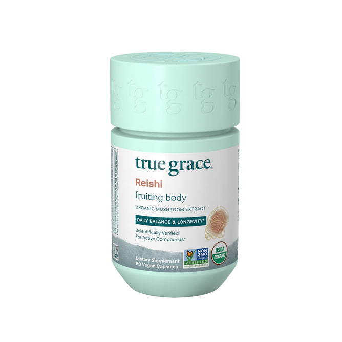 A light green True Grace container labeled Reishi contains organic Reishi fruiting body extract, promoting immune health, balance, and longevity. It includes 60 vegan capsules of USDA-certified organic mushrooms with various certification icons displayed.