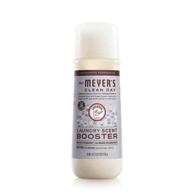 Mrs. Meyers Laundry Scent Booster, with a calming lavender aroma and plant-based components, comes in an 18 oz (510 g) white bottle featuring purple and gray designs.