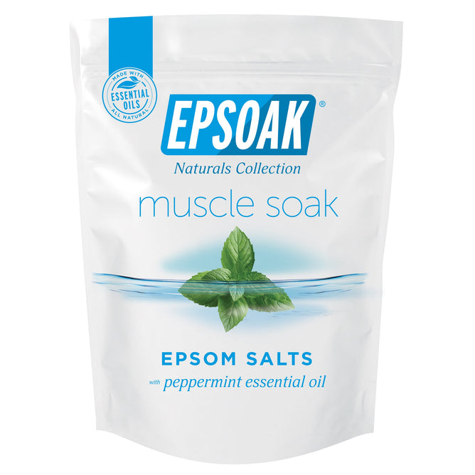 The Epsoak Everyday Muscle Soak by San Francisco Salt Co features white packaging with mint leaves and water, infused with peppermint essential oil. Its perfect for soothing sore muscles while emphasizing relaxation and natural ingredients.
