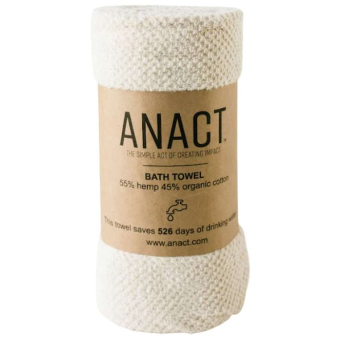 The rolled beige bath towel by Anact features a brown label. Made from 55% hemp and 45% organic cotton, the exfoliating Hemp and Organic Cotton Bath Towel saves 526 days of drinking water.
