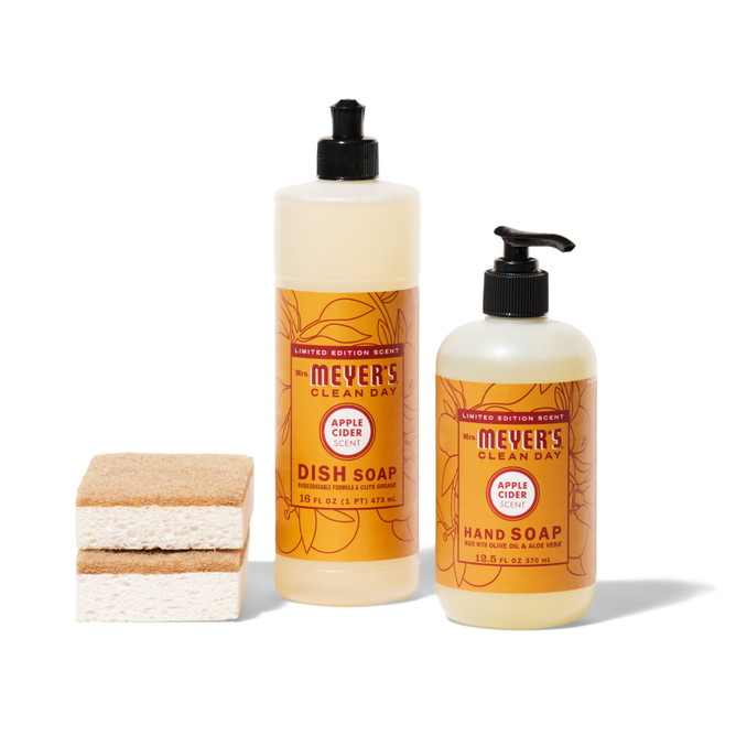 The Grove Collaborative crisp-clean-sinkside-set includes a pump dispenser dish soap and hand soap in apple cider scent, along with two tan and white layered sponges, all displayed on a white background.