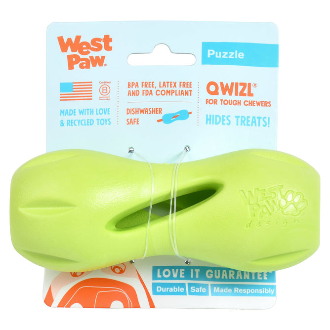 The West Paw Qwizl® Integrative Dog Toy, a bright green, bone-shaped treat extender for tough chewers, comes on a blue card highlighting its BPA-free, dishwasher-safe, recycled features and has a central hole for stuffing treats.