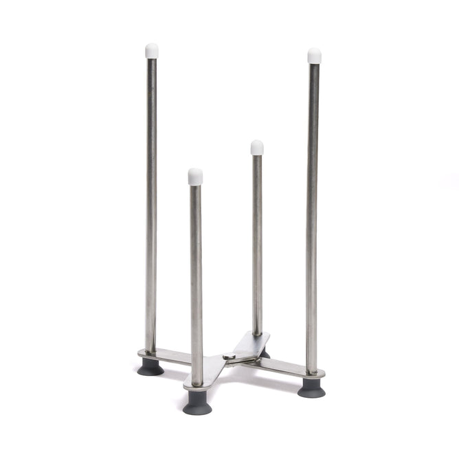 The Grove Co. Multi-Purpose Drying Rack is a stainless steel stand with four vertical poles of varying heights, each capped in white. Its versatile design includes four rubber feet for secure placement.