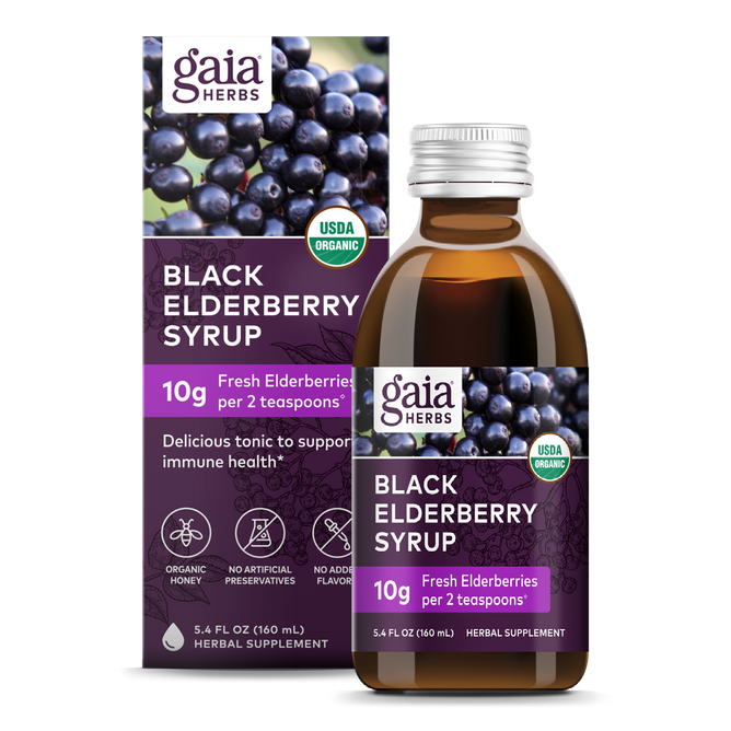A Gaia Herbs Black Elderberry Syrup bottle and box highlight 10g of organic black elderberries per 2 tsp. The USDA organic label ensures no artificial preservatives or flavors, with the box featuring elderberries for immune support.