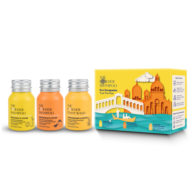 The Trust the Flow set by The Powder Shampoo includes three eco-friendly bottles and an Invigorating Powder Shampoo. Its colorful box features a scenic landscape, with buildings and a bridge reminiscent of Venetian gondolas gliding across the water.