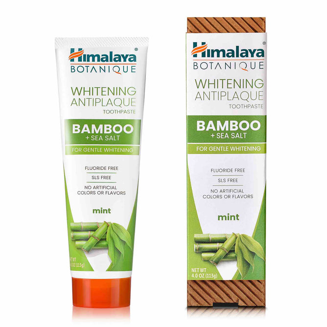 A tube and box of Himalaya Whitening Antiplaque Bamboo + Sea Salt Toothpaste. The green packaging, adorned with bamboo imagery, highlights its fluoride-free formula without artificial colors or flavors.
