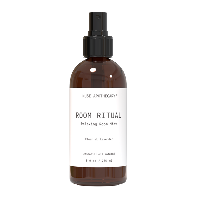 A brown bottle with a black spray nozzle, labeled Muse Apothecary Relaxing Room Mist, contains an aromatherapeutic blend of Fleur du Lavender. This 8 fl oz natural essential oil product is designed to soothe and calm your space.