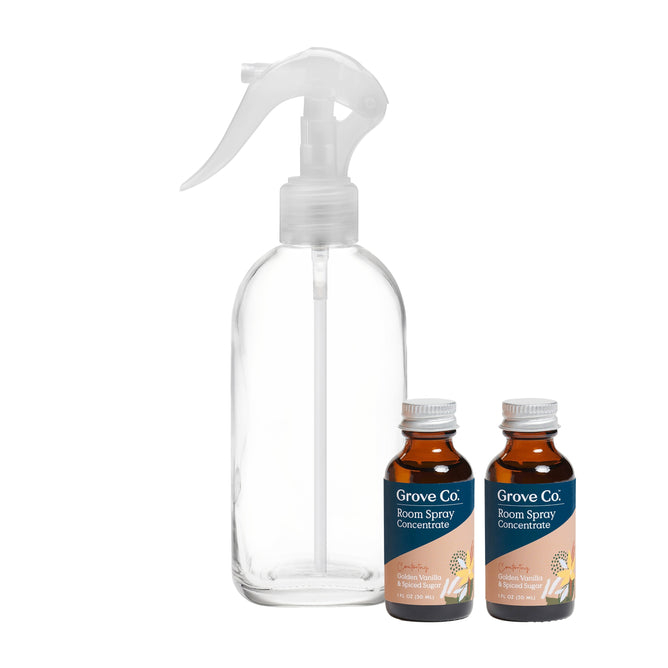 A Grove Co. Room Spray Gift Set includes a clear spray bottle with a white nozzle and two small brown bottles of Classic Concentrate in citrus and vanilla, ideal for easily refreshing any space.