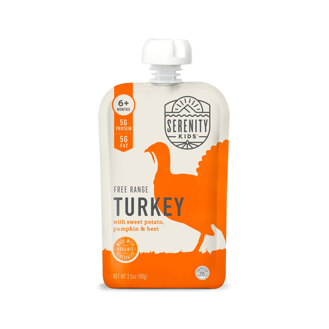 Serenity Kids baby food pouch features Free Range Turkey with organic sweet potato, pumpkin, and beet. Its orange and white packaging with a turkey silhouette is ideal for 6+ months, offering 5g protein, 5g fat, and Omega-3s to support growth.