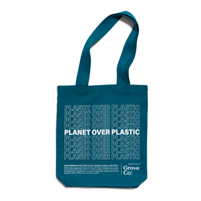 The Planet Over Plastic Reusable Tote Bag by Grove Co. features a teal design with Planet Over Plastic printed in white, emphasizing a plastic-free lifestyle and showcasing Grove Co.s commitment to sustainability at the bottom right corner.