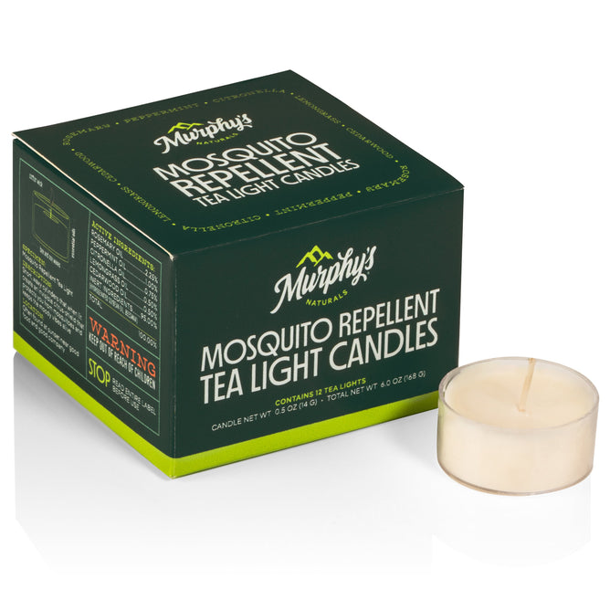 A dark green box labeled Murphys Naturals Mosquito Repellent Tea Light Candles featuring citronella oil and a lemongrass scent, made from natural soy, is placed next to a single white tea light candle.