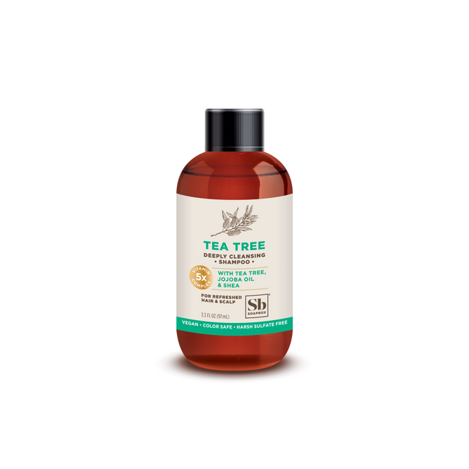 Soapboxs Tea Tree Deeply Cleansing Shampoo - Sample, in a 13.5 fl oz bottle with a black cap, features tea tree oil, jojoba oil, and shea. Its vegan, color-safe, sulfate-free, and designed for an invigorating and nourishing hair care experience.