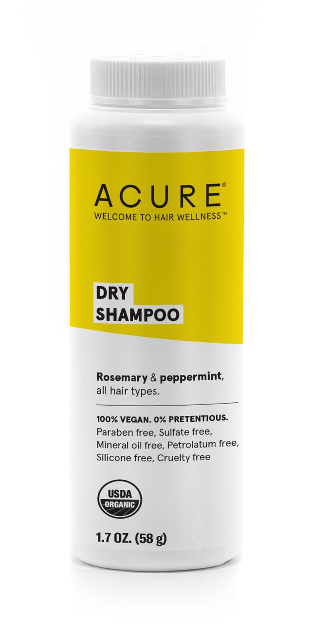 Acures 1.7 oz Dry Shampoo comes in a white cylindrical bottle with a yellow label, highlighting its natural hair care benefits. Suitable for all hair types, it features rosemary and peppermint, is vegan, organic, and free from parabens, sulfates, mineral oil, and silicone.