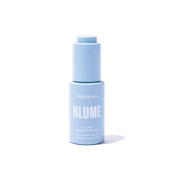 A light blue bottle of Blume Skincares Meltdown Oil for Acne-Prone Skin, designed to clear skin, stands upright against a white background. The bottle includes a matching cap and descriptive text.