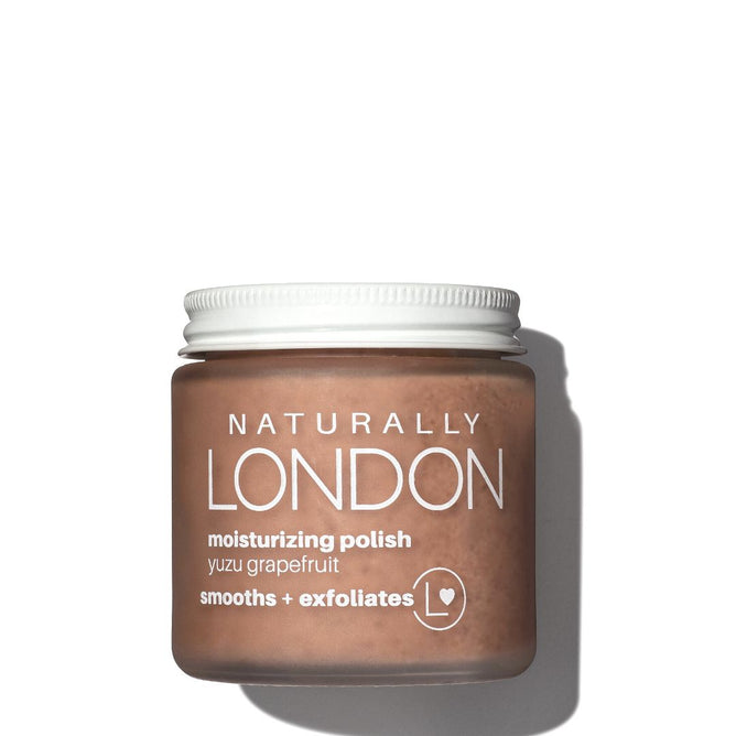 A jar of Naturally Londons Moisturizing Foot Polish with Calendula on a white background features a yuzu grapefruit blend enriched with adzuki beans as a natural exfoliator, offering to smooth and revitalize skin.