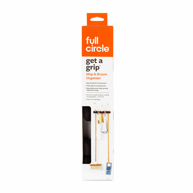 The Full Circle Get A Grip organizers packaging highlights versatile storage, featuring a mainly white design with an orange top and brand logo. It shows the wall-mounted organizer neatly holding cleaning tools.