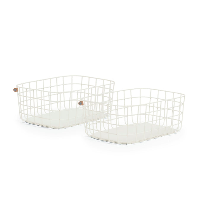 Two Large Wire Baskets from Open Spaces, made of high-quality white steel with wooden side handles and an open grid design, sit side by side on a white background, perfect for storing large blankets when not in use.