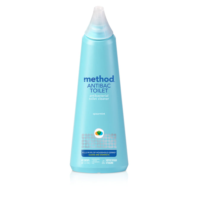 A blue bottle of method Toilet Cleaner with a pointed cap, featuring antibacterial claims and spearmint scent. The label highlights citric acid for germ removal, product claims, and icons.