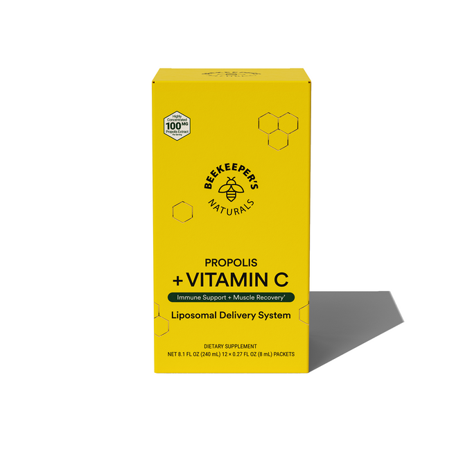 A yellow rectangular Propolis Liposomal and Vitamin C box by Beekeepers Naturals showcases honeycomb graphics, promotes immune support and muscle recovery, highlights the Liposomal Delivery System, and emphasizes Propolis and Vitamin Cs benefits.