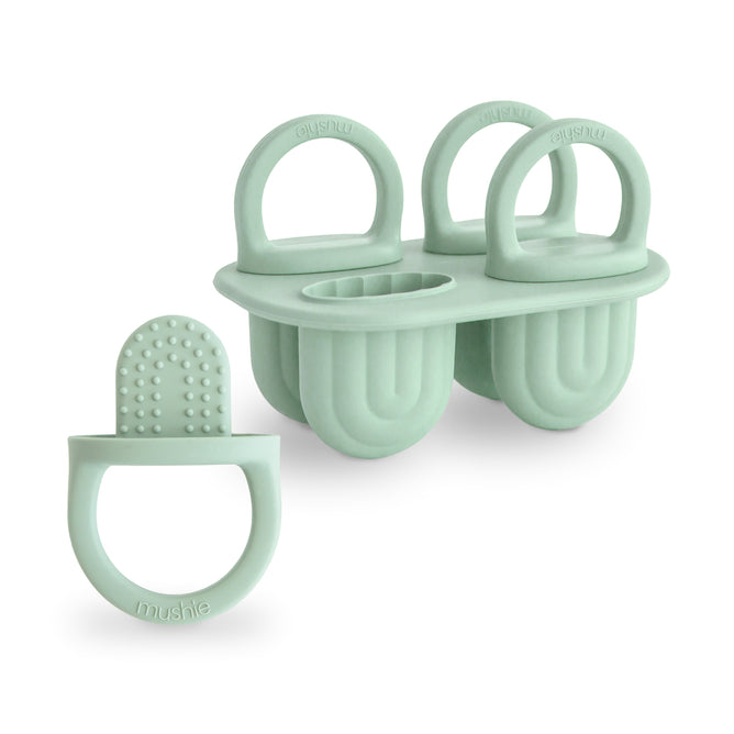 The mushie Toddler Ice Pop Tray—BPA-free, food-grade silicone with four green molds and rounded handles—features an easy-release, textured design perfect for making healthy treats for toddlers.