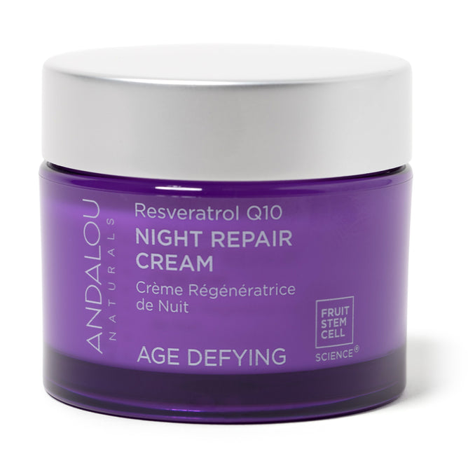 A jar of Andalou Naturals Age Defying Resveratrol Q10 Night Repair Cream has a purple label and white screw-on lid. Utilizing Fruit Stem Cell Science and antioxidants, it offers effective anti-aging care.