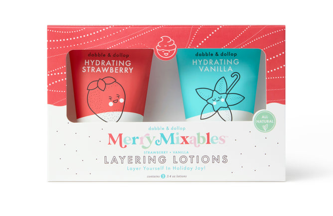 The Dabble & Dollop Merry Mixables Layering Lotions holiday gift set includes two all-natural lotions: a red-labeled Hydrating Strawberry with a strawberry design and a teal-labeled Hydrating Vanilla featuring a vanilla flower illustration.