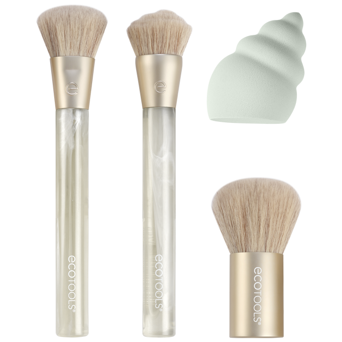 The EcoTools Eco Sea Gems Face Set offers cruelty-free, vegan makeup brushes with beige bristles and light brown handles featuring the EcoTools logo, along with a distinctively shaped green blending sponge.