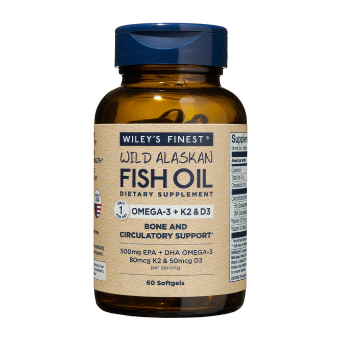 Wileys Finest Wild Alaskan Fish Oil - Omega-3 + K2 & D3 dietary supplement supports bone and circulatory health. It includes 60 softgels in an amber bottle with a navy blue cap and label.