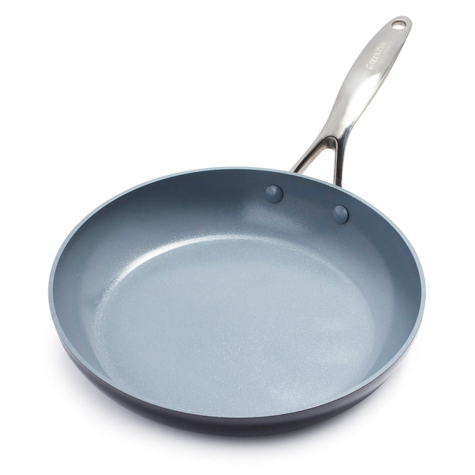 The Valencia Pro Ceramic Nonstick Fry Pan by GreenPan is made of hard-anodized aluminum, featuring a shiny silver handle against a plain white background. This 12 pan has a smooth gray ceramic nonstick interior, presenting a sleek and modern design.