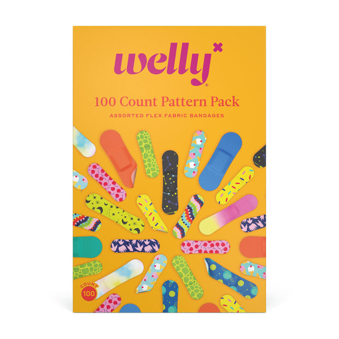 The vibrant Welly Bravery Bandages Refill tin features an array of patterns and bold text: 100-Count Pattern Pack and Assorted Flex Fabric Bandages on an orange backdrop, surrounded by playful bandage designs.