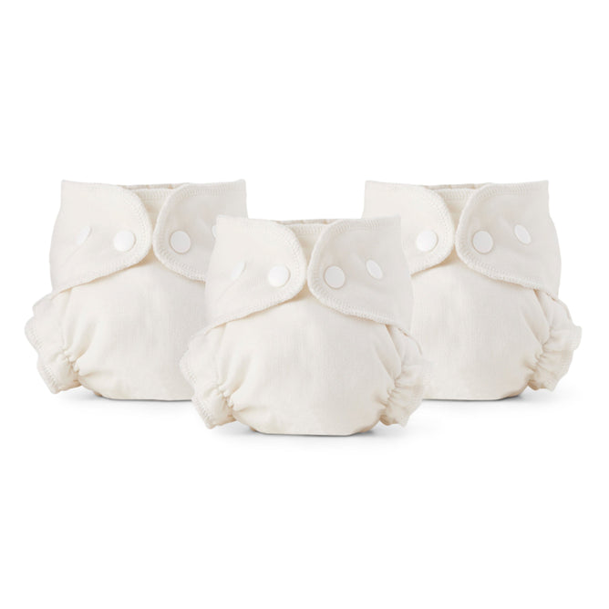 Three cream-colored Cloth Diaper Inner, Size 2 products from Esembly Baby are shown in a row on a white background. Made from 100% OEKO-TEX certified unbleached organic cotton, each has snap closures, elastic leg openings, and a soft padded look.