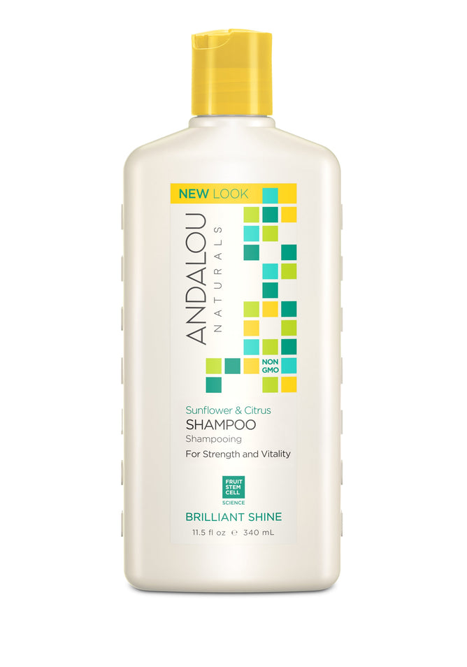 Bottle of Andalou Naturals Brilliant Shine Sunflower & Citrus Shampoo against a white background. The label highlights strength and vitality, powered by natural ingredients and fruit stem cell science. This sulfate-free shampoo enhances shine and comes in an 11.5 fl oz (340 ml) bottle.