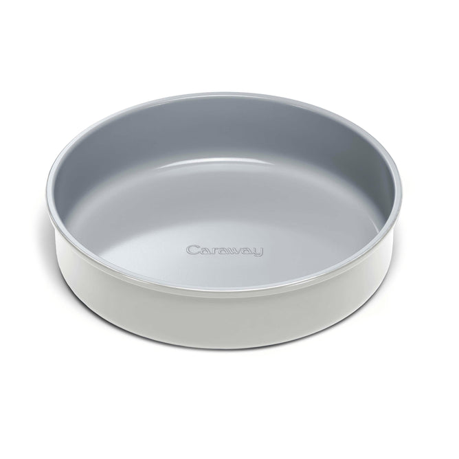 A 9 Circle Cake Pan in grey, featuring a smooth ceramic coating with Caraway branded on the bottom interior. It has a glossy, modern design and a reliable non-stick surface for easy baking.