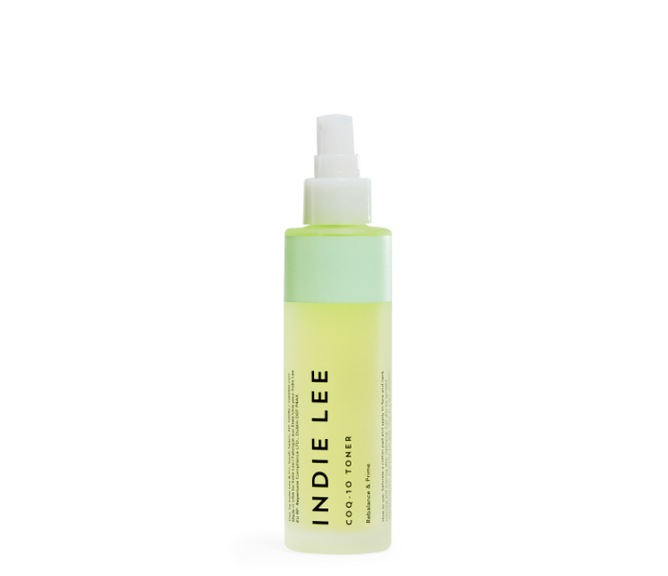 The Indie Lee CoQ10 Toner comes in a cylindrical bottle with a white spray nozzle. The bottom is translucent yellow, and the top is light green. Antioxidant-rich, the product details and brand name are printed in black on the bottle.