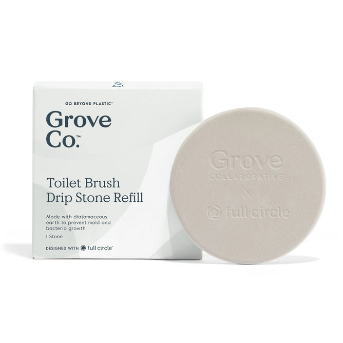 The round, beige Toilet Brush Drip Stone refill by Grove Co. is displayed next to its packaging, emphasizing its natural diatomaceous earth that resists bacteria and mold, created alongside Full Circle.