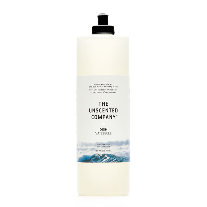 A tall, transparent bottle of The Unscented Company Dish Soap features a white label with black text and a blue wave design at the bottom. It has a black flip-top cap and states its eco-friendly and unscented.