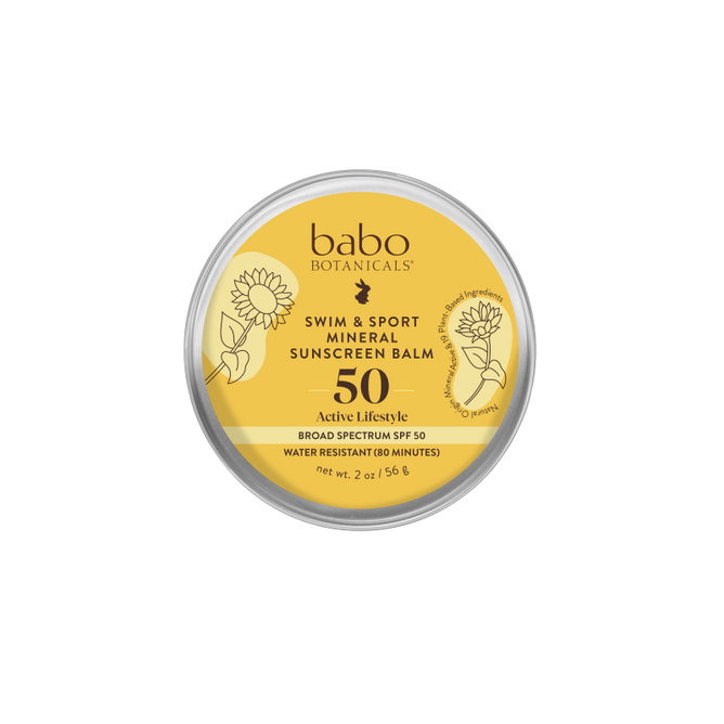 Babo Botanicals Swim & Sport Mineral Balm - SPF 50 comes in a travel-friendly, round yellow tin with a sunflower-adorned lid. This plastic-free sunscreen provides broad-spectrum protection and is water-resistant for up to 80 minutes.