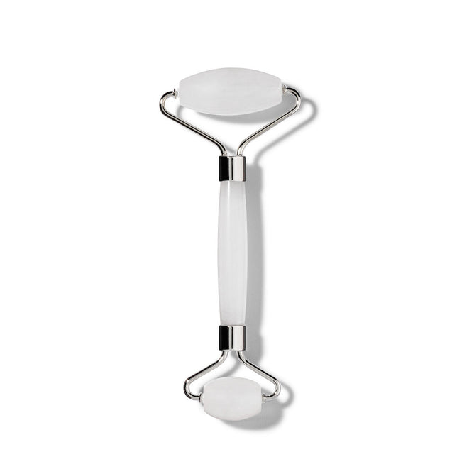 The Terra Beauty Bars Frosted Quartz Facial Roller features dual-sized rollers on each end with a smooth connecting handle, mounted on metal brackets. Its expertly crafted for facial massage and skin depuffing against a minimalist plain white background.
