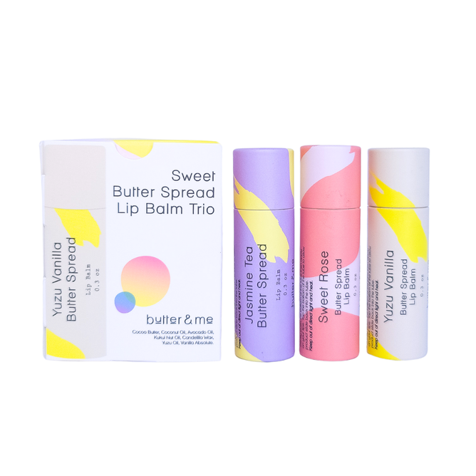 The Butter Spread Lip Balm Trio by butter & me hydrates lips luxuriously in colorful eco-friendly tubes, with scents of Yuzu Vanilla, Jasmine Tea, and Sweet Rose. Enhance your lips with this vibrant set while soothing chapped lips with rich moisture and style.