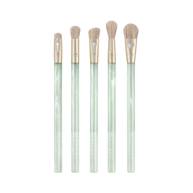 Explore the EcoTools Eco Sea Gems Eye Set, a five-piece brush collection boasting translucent light green handles and soft beige bristles. These cruelty-free, vegan makeup tools are beautifully displayed against a white background.