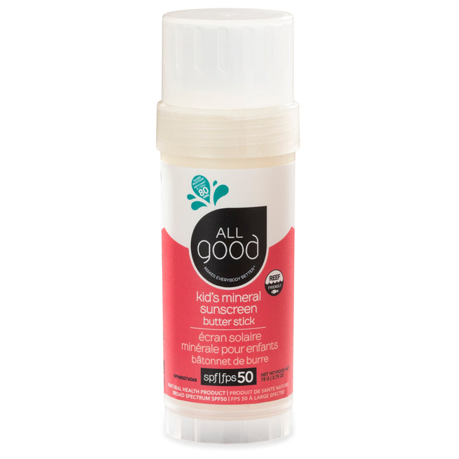 A vertical tube of All Good Mineral Kids Sun Butter Stick with SPF 50, featuring white and red packaging. The label includes a logo and text in English and French. Made with organic ingredients, it has an off-white cap atop the vibrant red bottom half.
