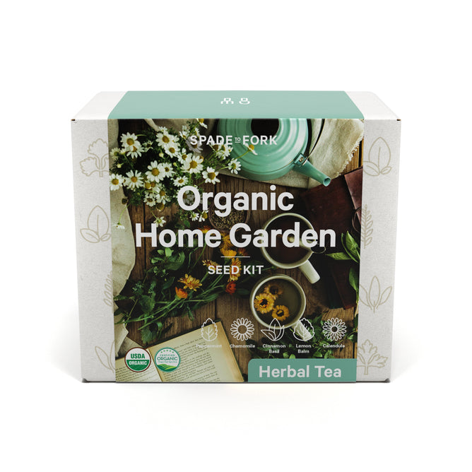 The Organic Herbal Tea Kit from Spade to Fork highlights herbal tea and plants with USDA Organic and non-GMO icons. A background of daisies, a tea cup, and gardening tools emphasizes easy cultivation for organic garden kit enthusiasts.