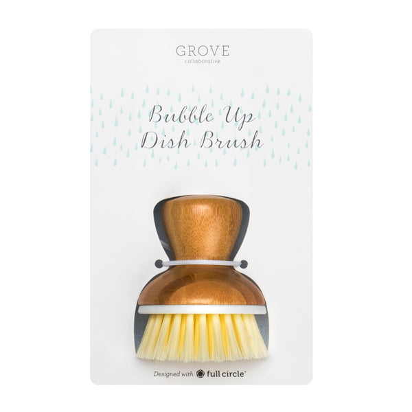 The Bubble Up Replacement Dish Brush by Grove Co. has a sturdy wooden handle and durable white bristles, paired with a Bubble Up base for stability. Designed with full circle text at the bottom highlights its eco-friendly commitment.
