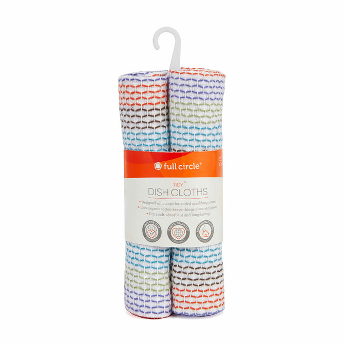 Two rolled Full Circle Tidy - Dish Cloths feature a multicolored grid, wrapped in a branded label. Made of 100% organic cotton, they offer great absorbency and durability. The top hook allows easy hanging, reducing the need for paper towels effectively.