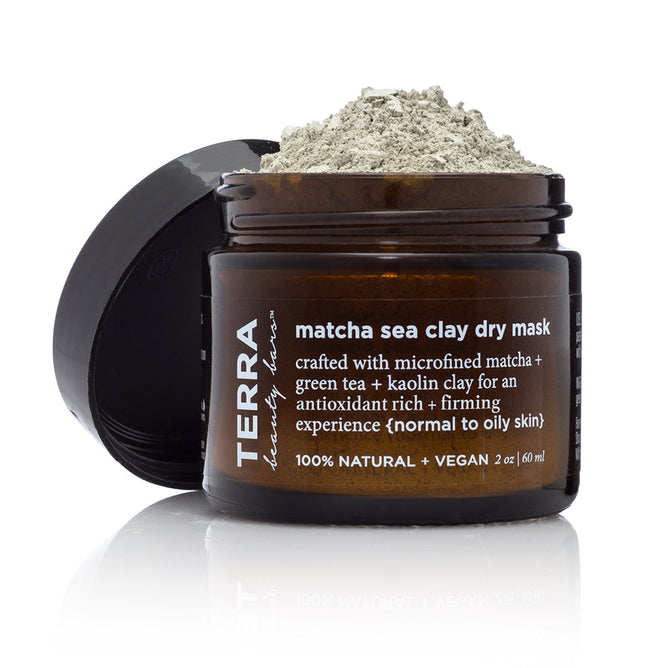 An open Terra Beauty Bars Matcha Sea Dry Facial Clay Mask jar reveals light green powder. Its label highlights vegan ingredients like matcha, green tea, and kaolin clay for normal to oily skin. This antioxidant-rich formula is both natural and vegan.