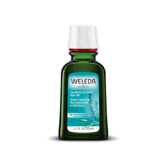 A green glass bottle of Weleda Conditioning Hair Oil features a white cap and a light blue label with a rosemary oil illustration. This 1.7 FL OZ (50ml) hair treatment promises nourishing conditioning.