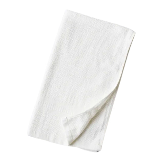 A Hemp and Organic Cotton Hand Towel by Anact, featuring a soft white texture, rounded edges, and a fluffy, absorbent feel, is neatly folded against a white background.